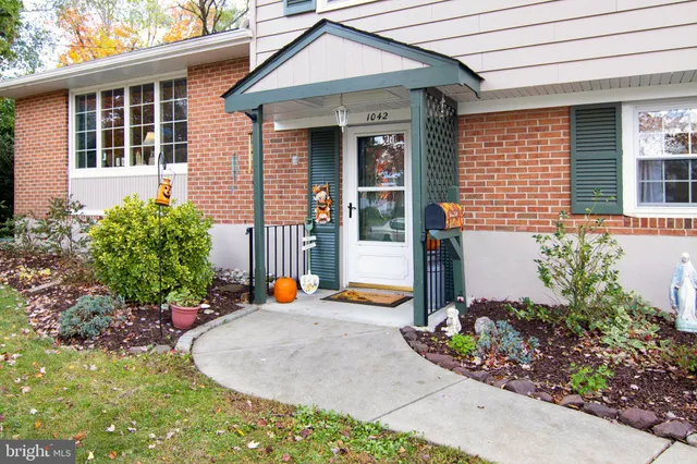 a view of a livingroom with wooden floor and a cabinet