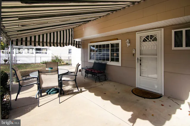 a view of swimming pool with outdoor seating