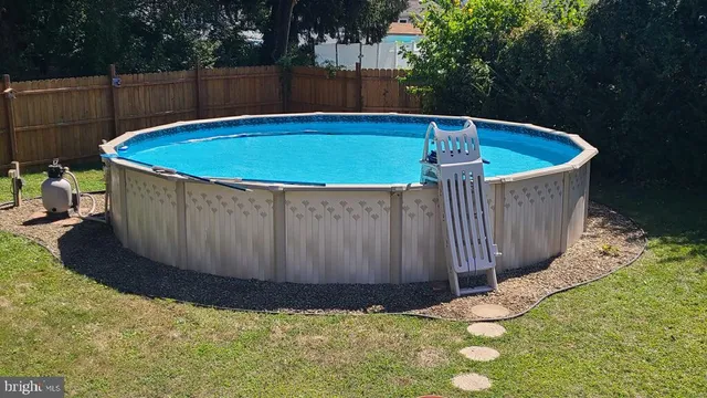 a view of a swimming pool with a patio