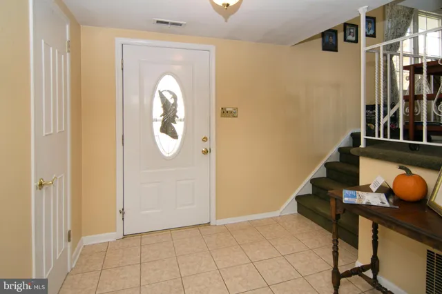 a view of an entryway and livingroom