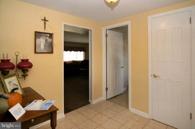 a view of a livingroom with furniture and staircase
