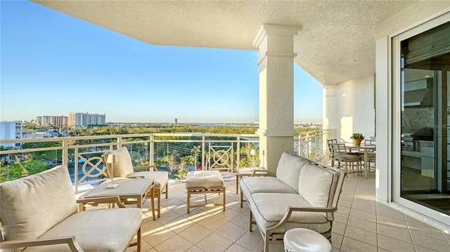 a balcony with furniture and city view