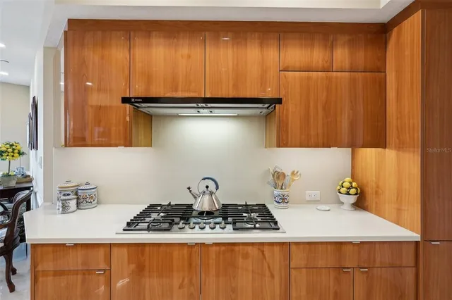 a kitchen with a sink and cabinets