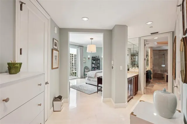 a bedroom with a bed and a table in it