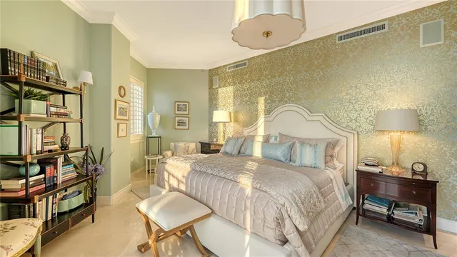 a bedroom with a large bed and a large window with outer view