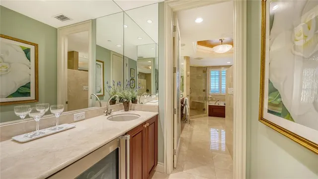 a bedroom with a bed and a flat tv screen on dresser