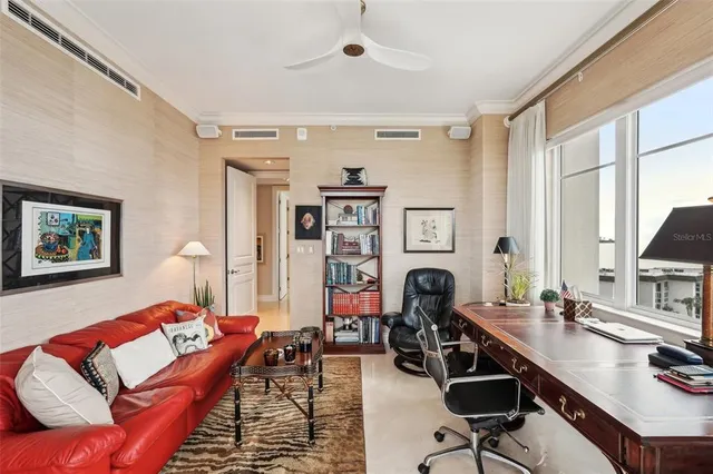 a living room with furniture and a window