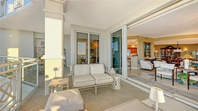 a balcony with furniture and outdoor view