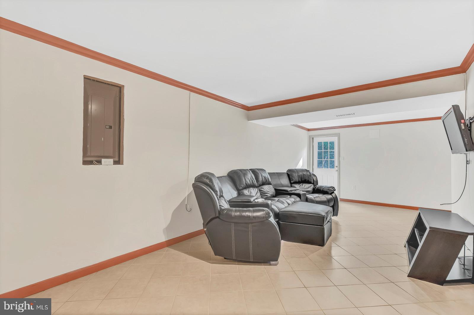6815 Mackall Road St. Leonard, MD 20685 - Photo 32 of 38 a living room with furniture and a mirror