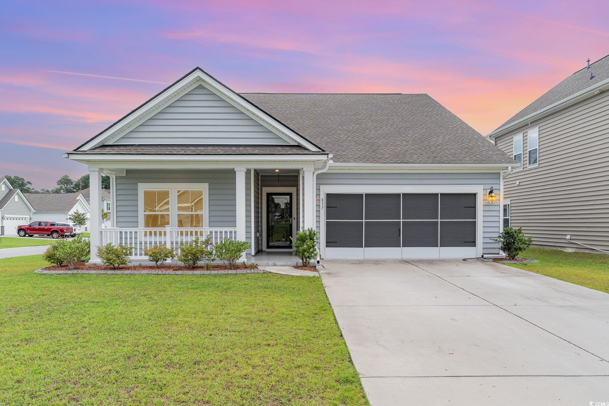 837 Brant Street Myrtle Beach, SC 29579 - Photo 1 of 40 View of front of home featuring a porch, a garage,