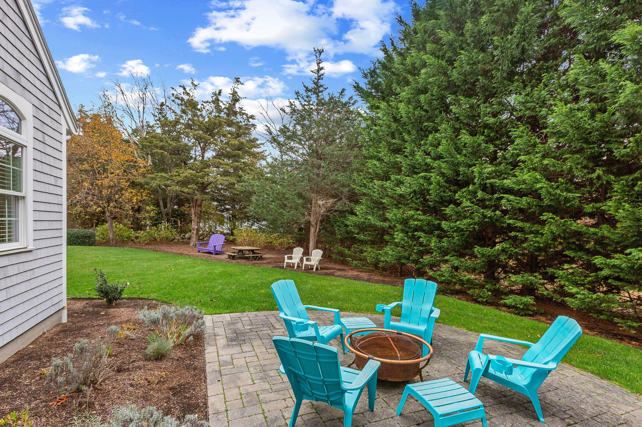 13 Hayfield Road East Dennis, MA 02641 - Photo 12 of 51 a view of a chairs and table in the garden