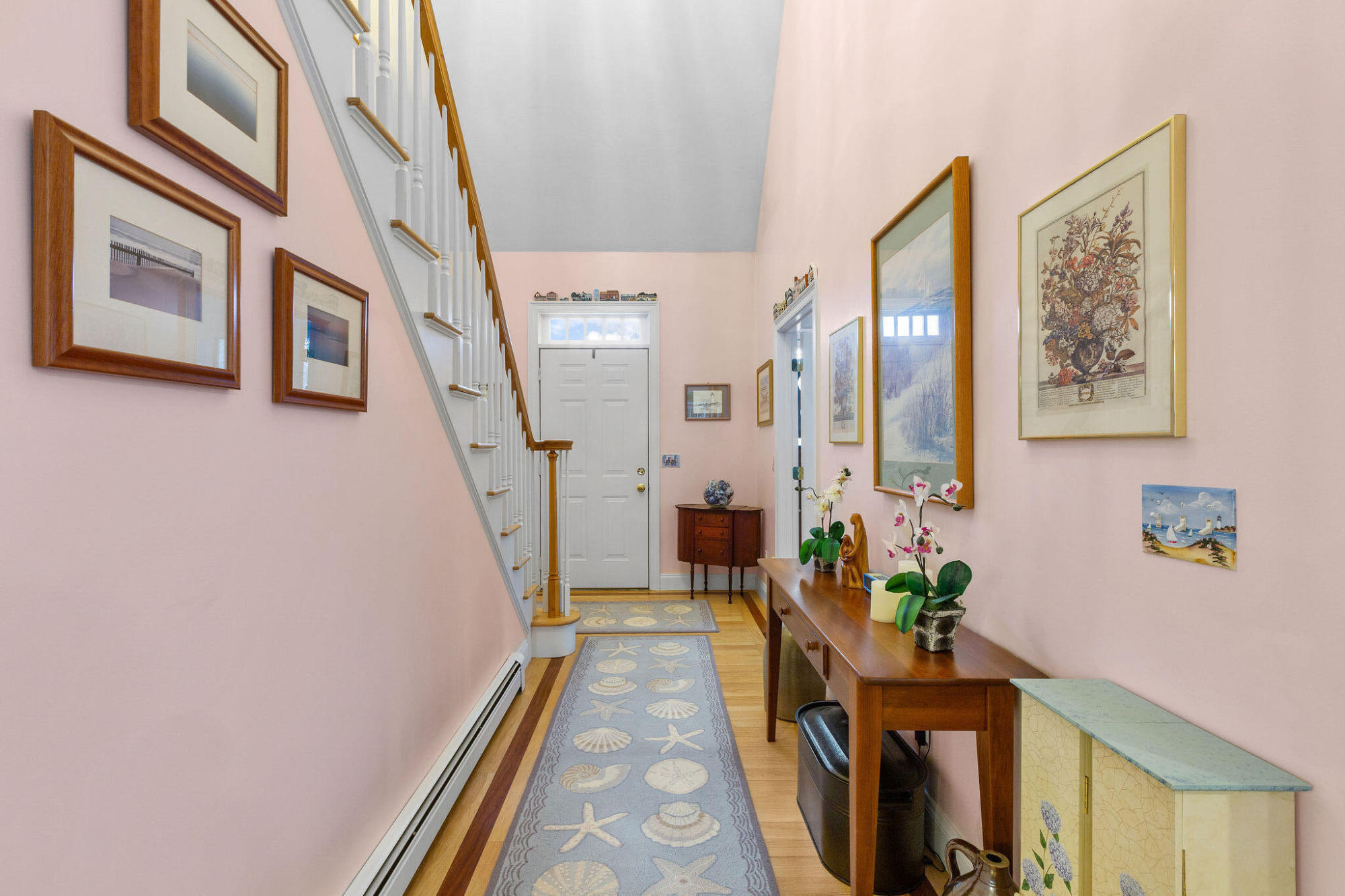 13 Hayfield Road East Dennis, MA 02641 - Photo 16 of 51 a hallway with couches wooden floor and a potted plant