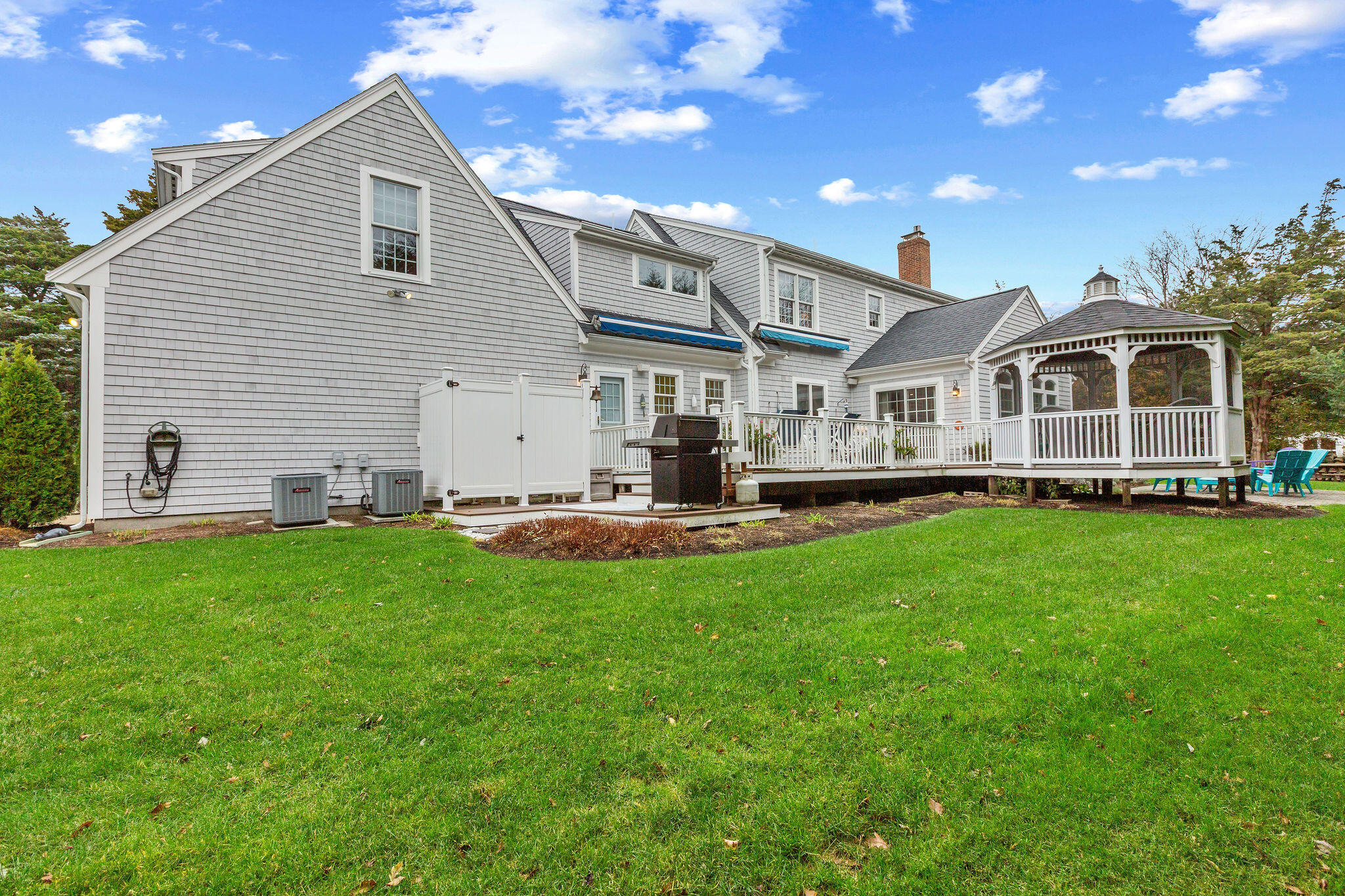 13 Hayfield Road East Dennis, MA 02641 - Photo 6 of 51 a front view of a house with a garden and plants