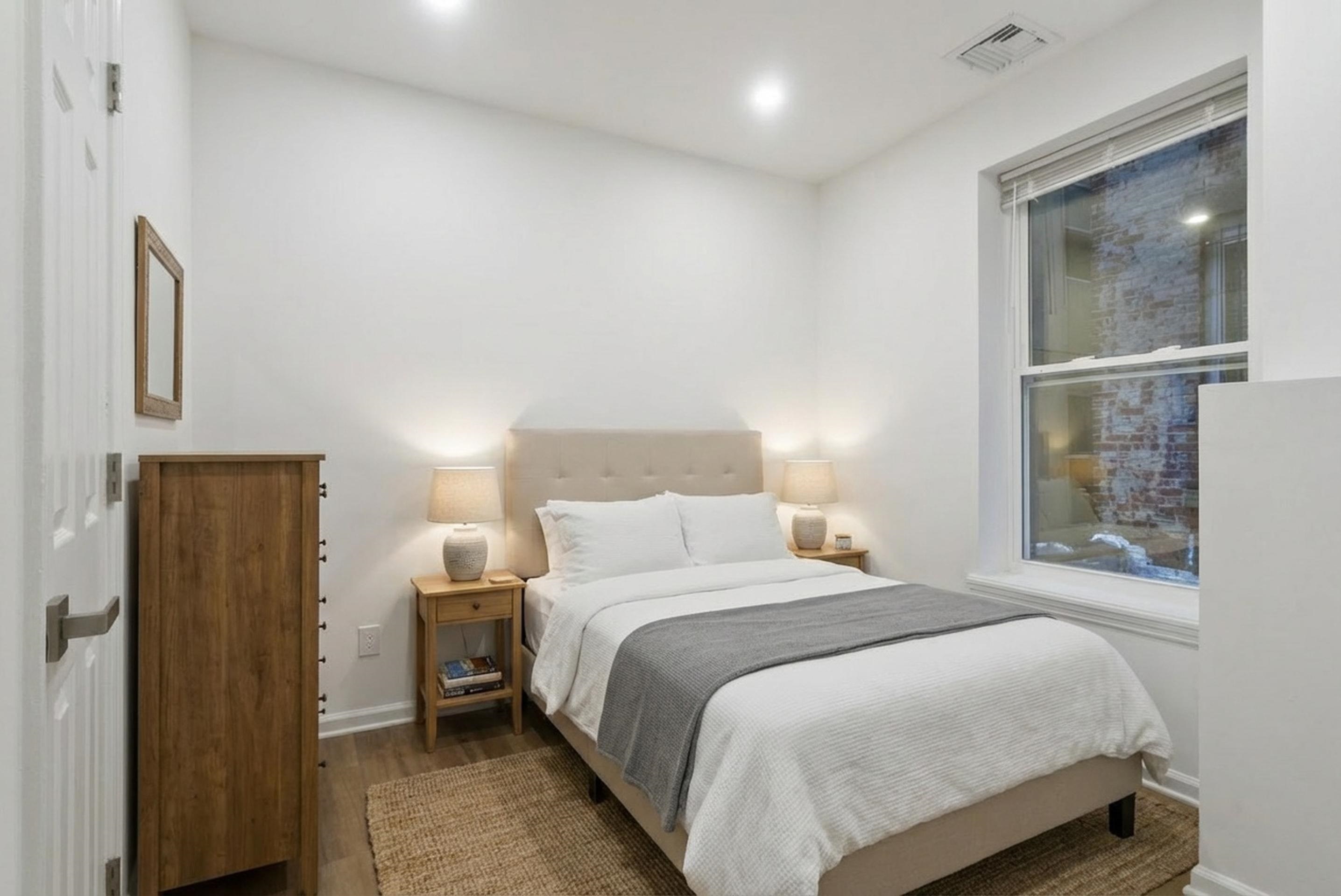 419 5th Street, Unit A Hoboken, NJ 07030 - Photo 13 of 16 a bedroom with a bed and a window