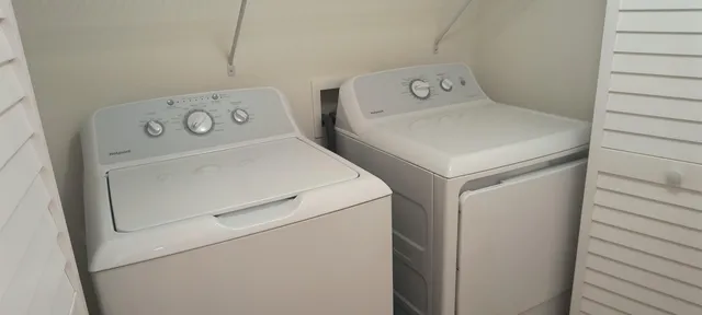 a view of a garden with a building in the background