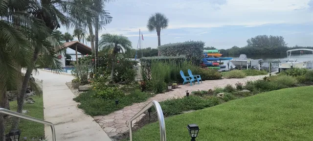 a view of a swimming pool with chairs
