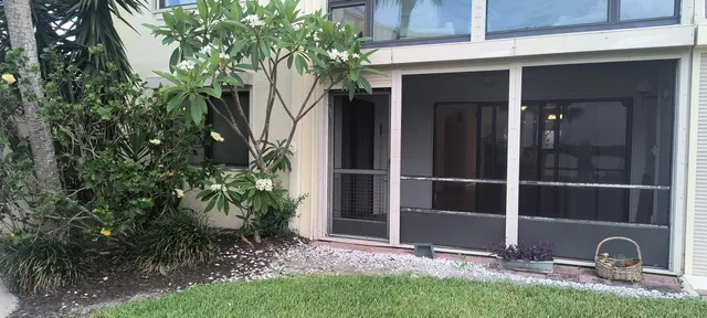 a view of a swimming pool with outdoor seating