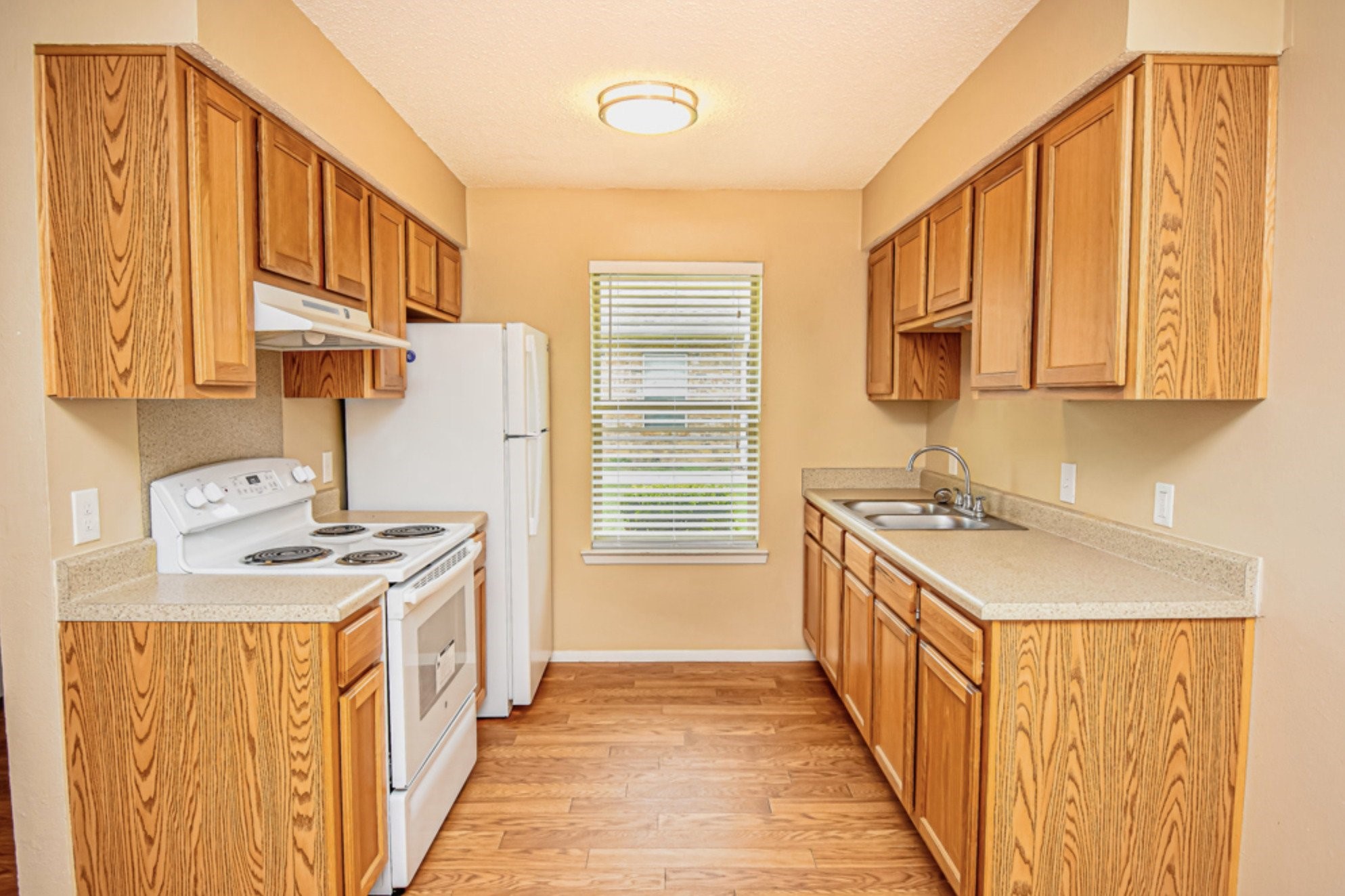427 Martin Street Chandler, TX 75758 - Photo 10 of 11 a kitchen with a sink stove top oven and cabinets