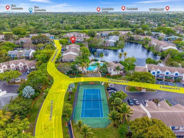 an aerial view of residential house with outdoor space and lake view