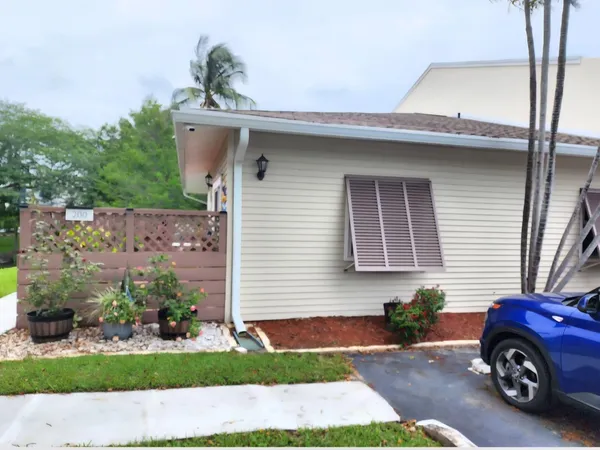 a kitchen with kitchen island white cabinets and stainless steel appliances