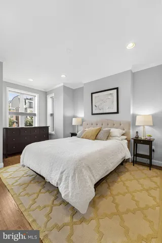 a bedroom with a bed and a couch