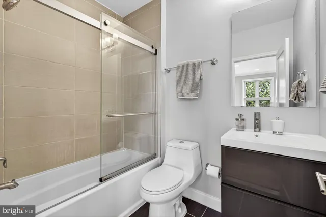 a bathroom with a toilet a sink and a shower