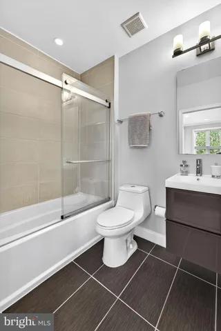 a bedroom with furniture and a rug