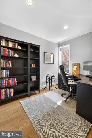 a view of a workspace with bookshelf