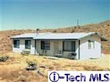 25980 Alameda Road Apple Valley, CA 92308 - Photo 1 of 1 a view of a house with wooden fence