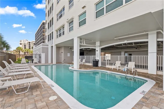 a view of a patio with chairs and tables