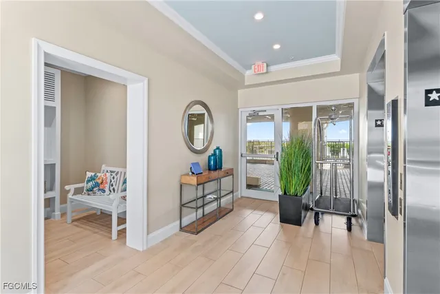 a living room with furniture and a mirror