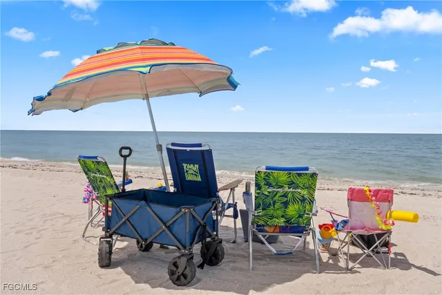 a view of backyard with outdoor seating and plants