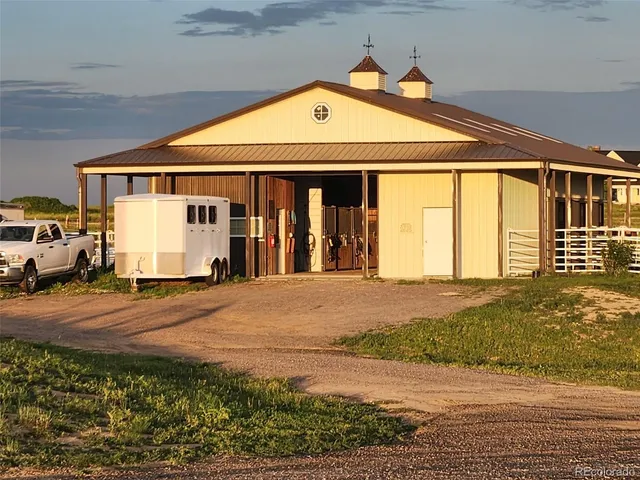 a view of an empty room with wooden walls