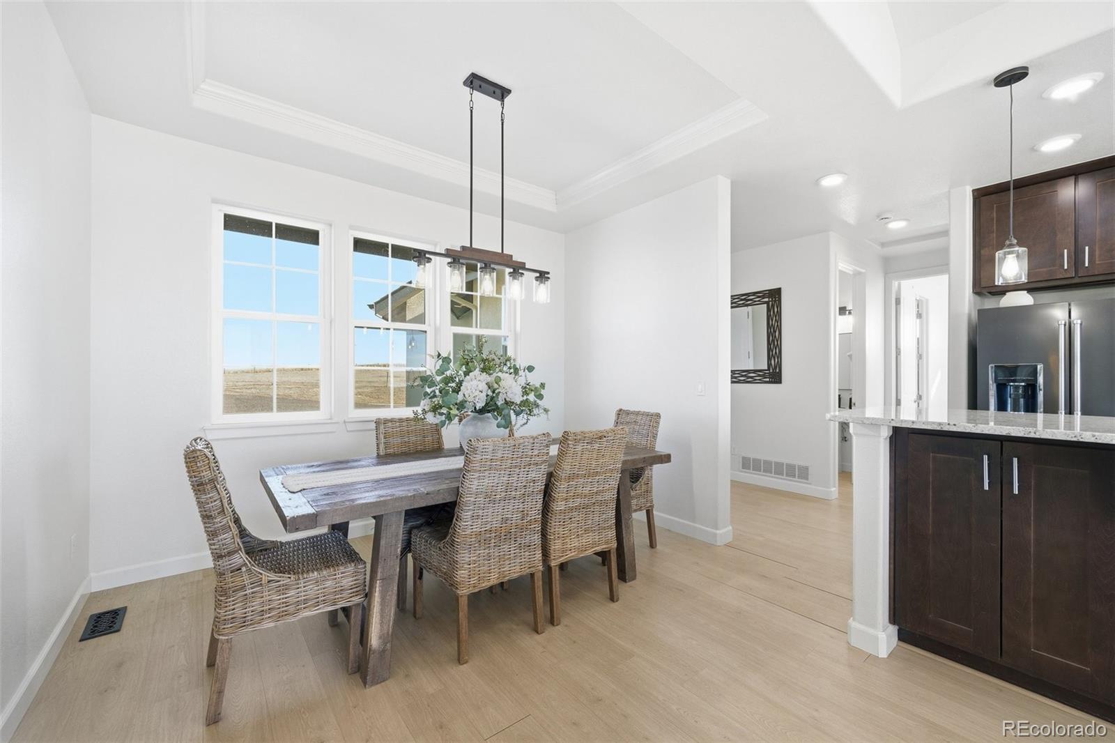 7600 Patrick Trail Elizabeth, CO 80107 - Photo 29 of 50 a view of a dining room with furniture window and wooden floor