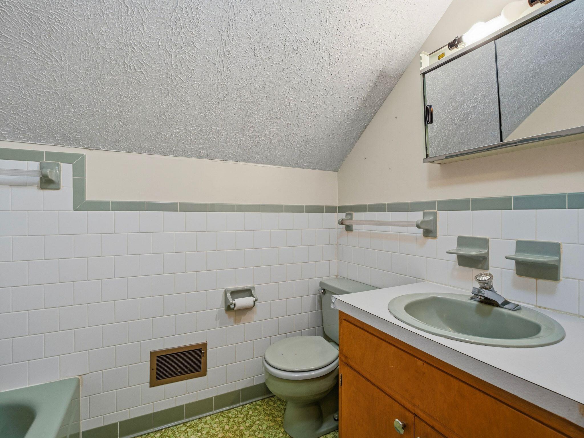 1115 Robin Ridge Road Henry, VA 24102 - Photo 25 of 54 a bathroom with a sink a toilet and a mirror