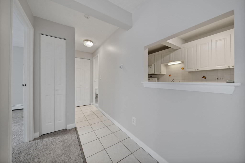 55 Eleanor Street, Unit 17 Chelsea, MA 02150 - Photo 17 of 21 a view of an empty room and kitchen