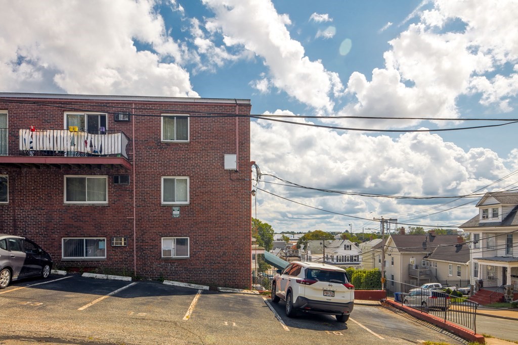 55 Eleanor Street, Unit 17 Chelsea, MA 02150 - Photo 3 of 21 a car parked in front of a building