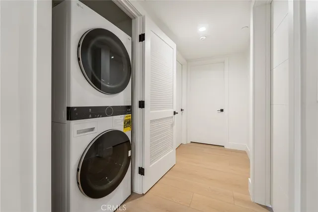 a view of a hallway with washer and dryer
