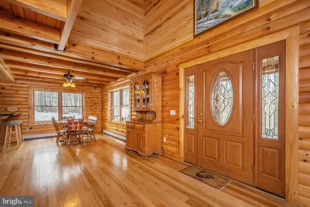 a view of a patio with table and chairs