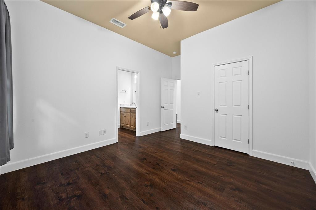 2526 Fox Point Circle Quinlan, TX 75474 - Photo 20 of 35 Master bedroom opens onto master bath