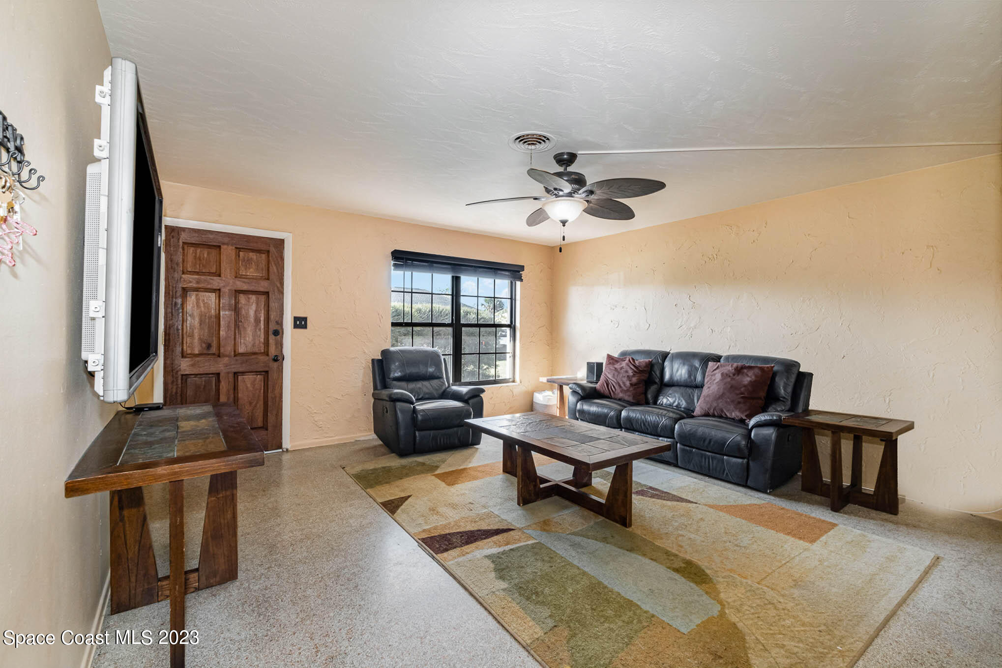 2710 Locksley Road Melbourne, FL 32935 - Photo 8 of 25 a living room with furniture and a window