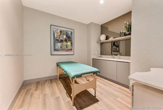 a room with painting and a table