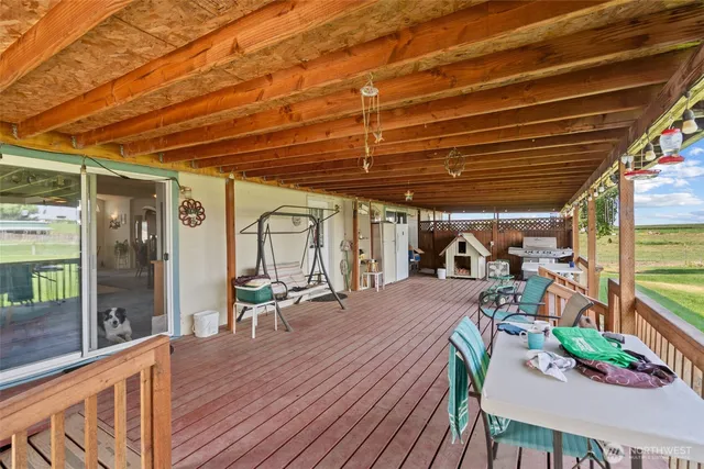 a view of a chairs and table in the patio