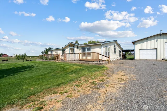 a view of a house with a big yard