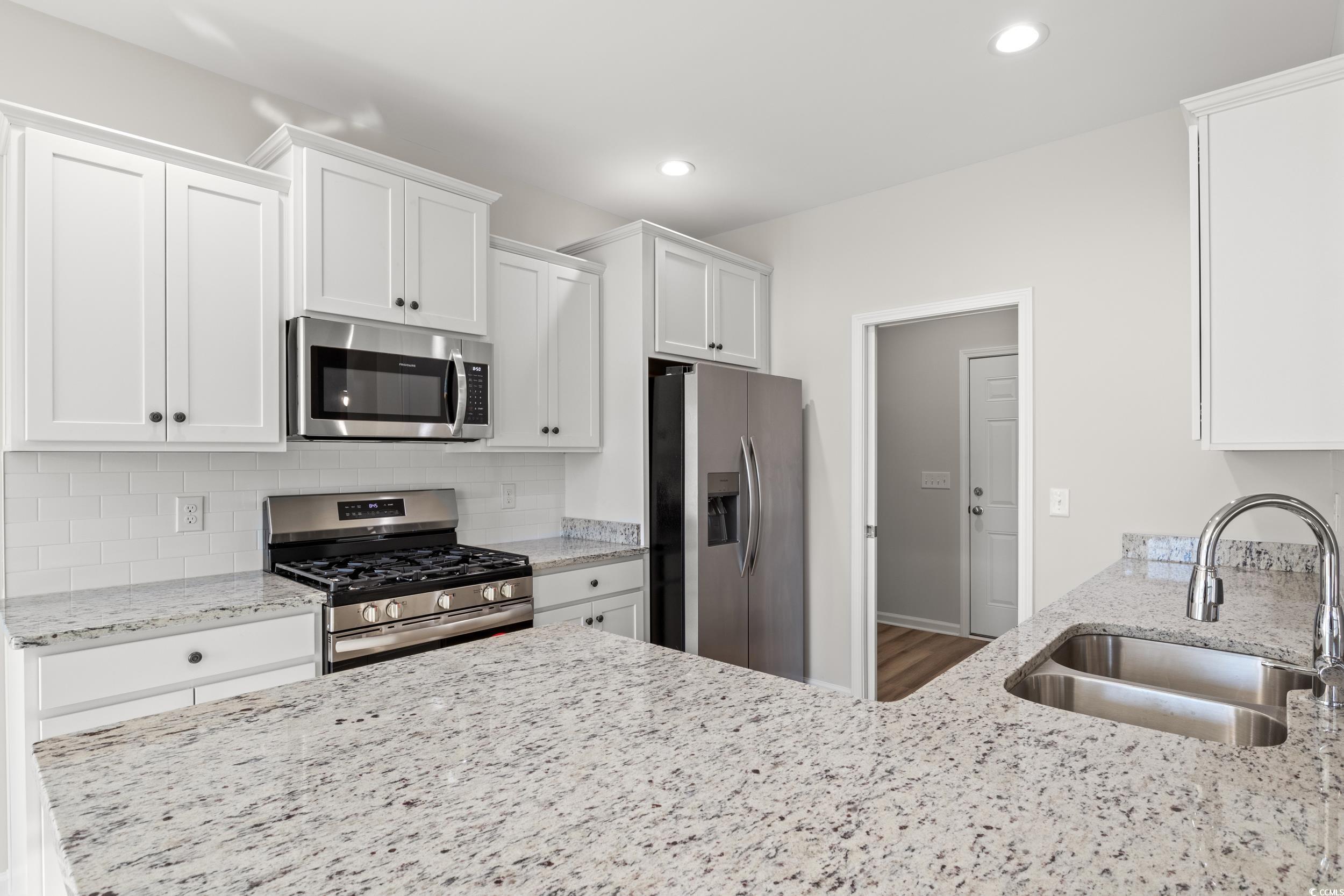 312 Lakota Loop Longs, SC 29568 - Photo 5 of 17 Kitchen featuring hardwood / wood-style floors, wh