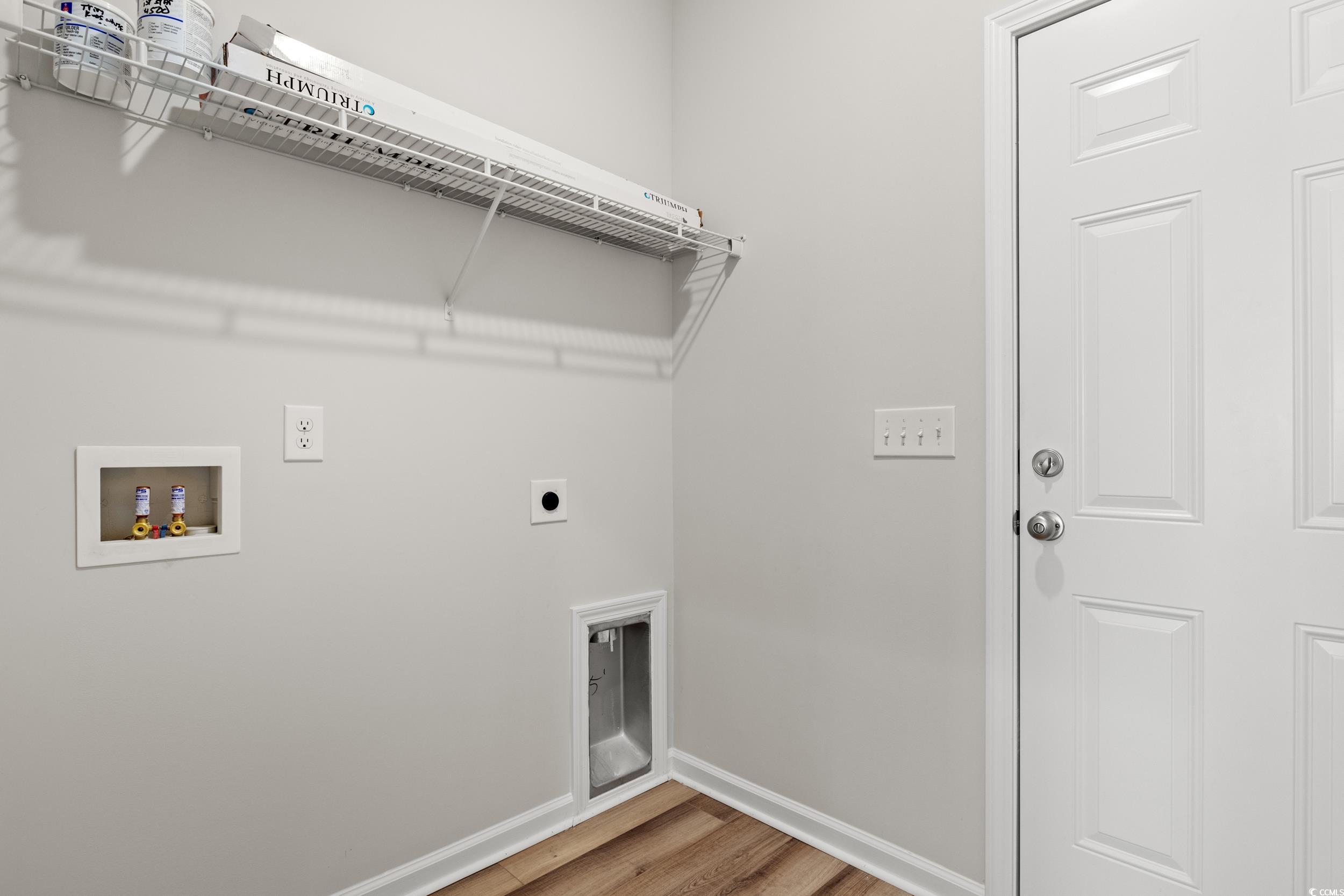 312 Lakota Loop Longs, SC 29568 - Photo 6 of 17 Laundry room with hardwood / wood-style floors, ho