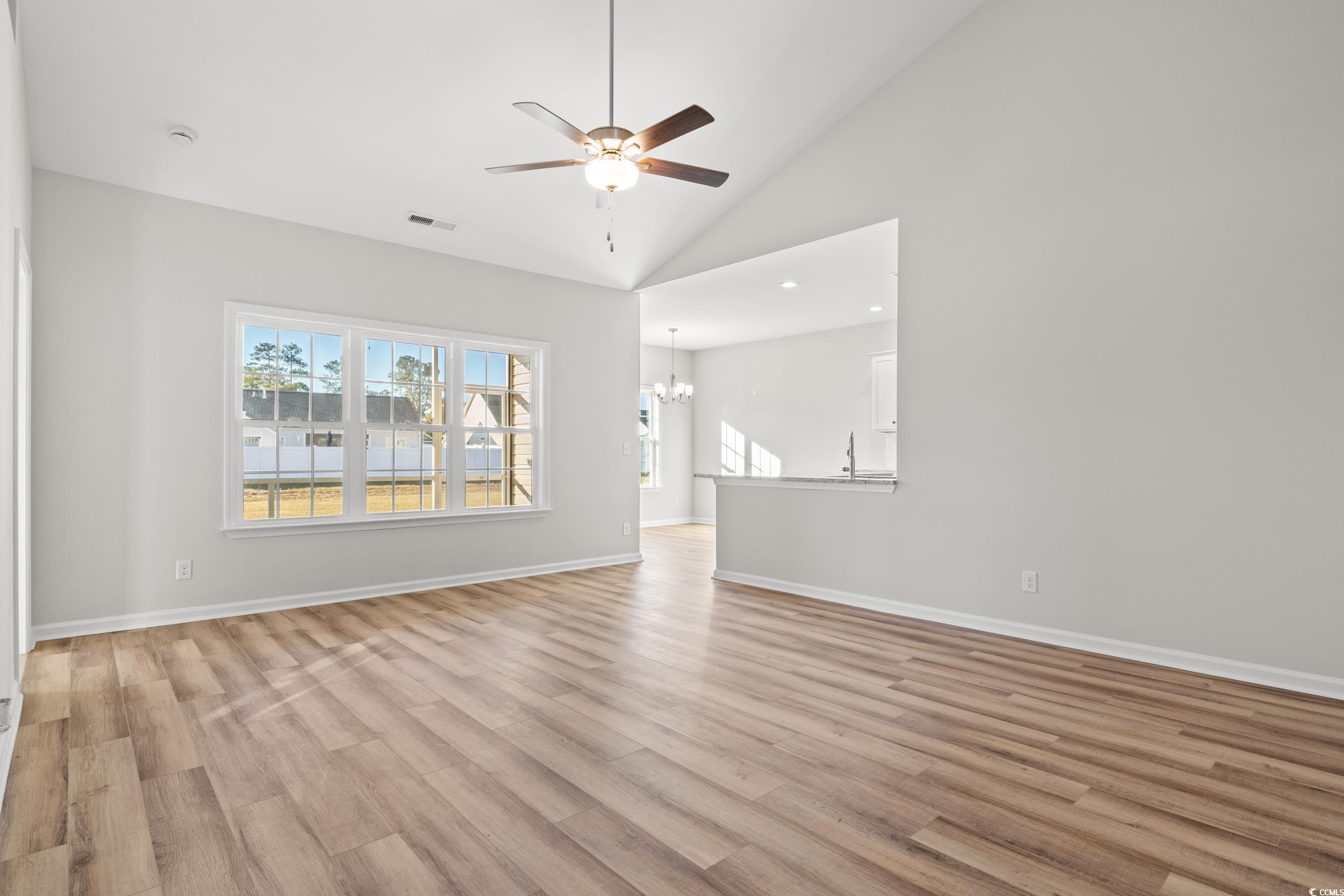 312 Lakota Loop Longs, SC 29568 - Photo 7 of 17 Unfurnished living room with ceiling fan with nota