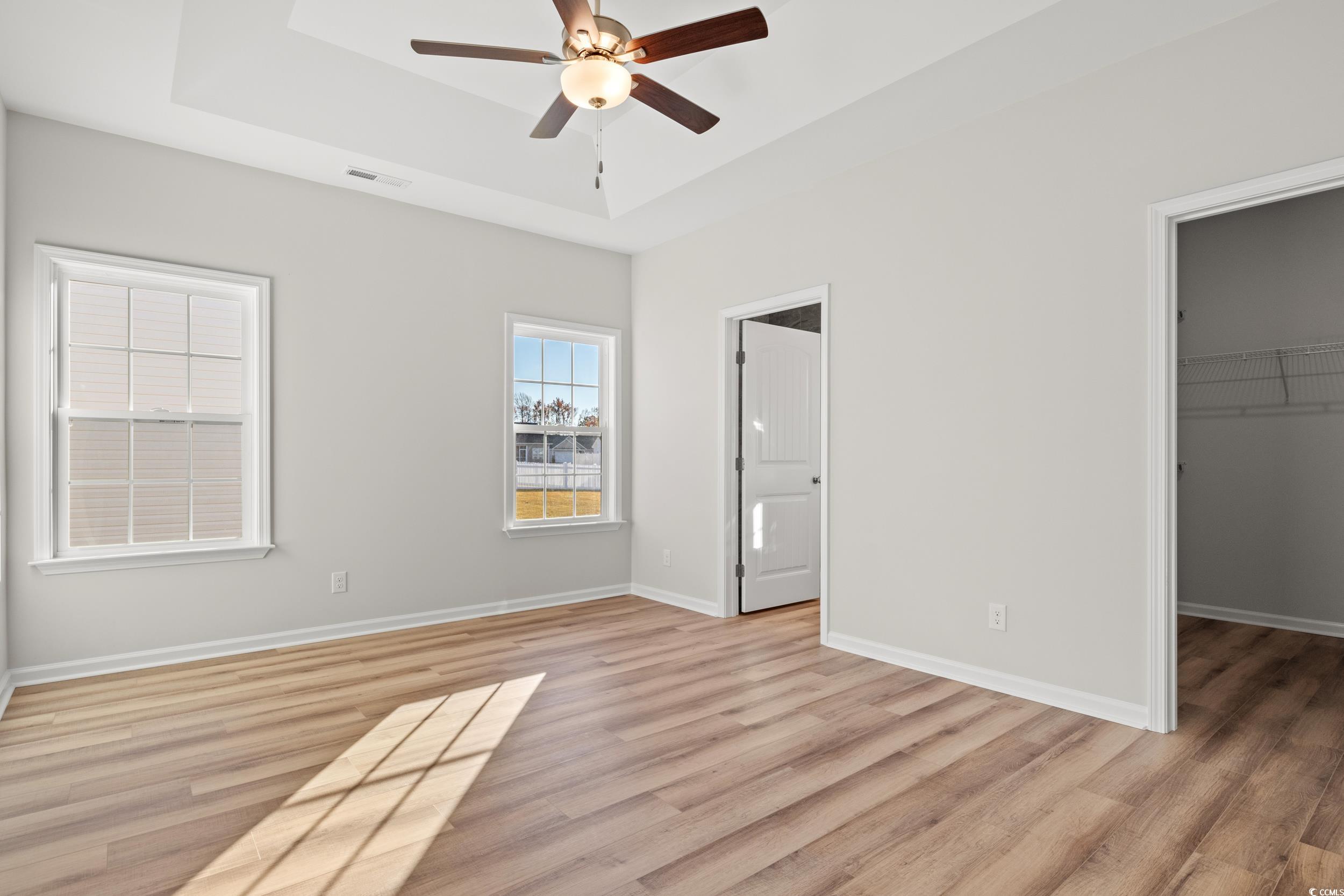 312 Lakota Loop Longs, SC 29568 - Photo 8 of 17 Unfurnished bedroom featuring a walk in closet, a