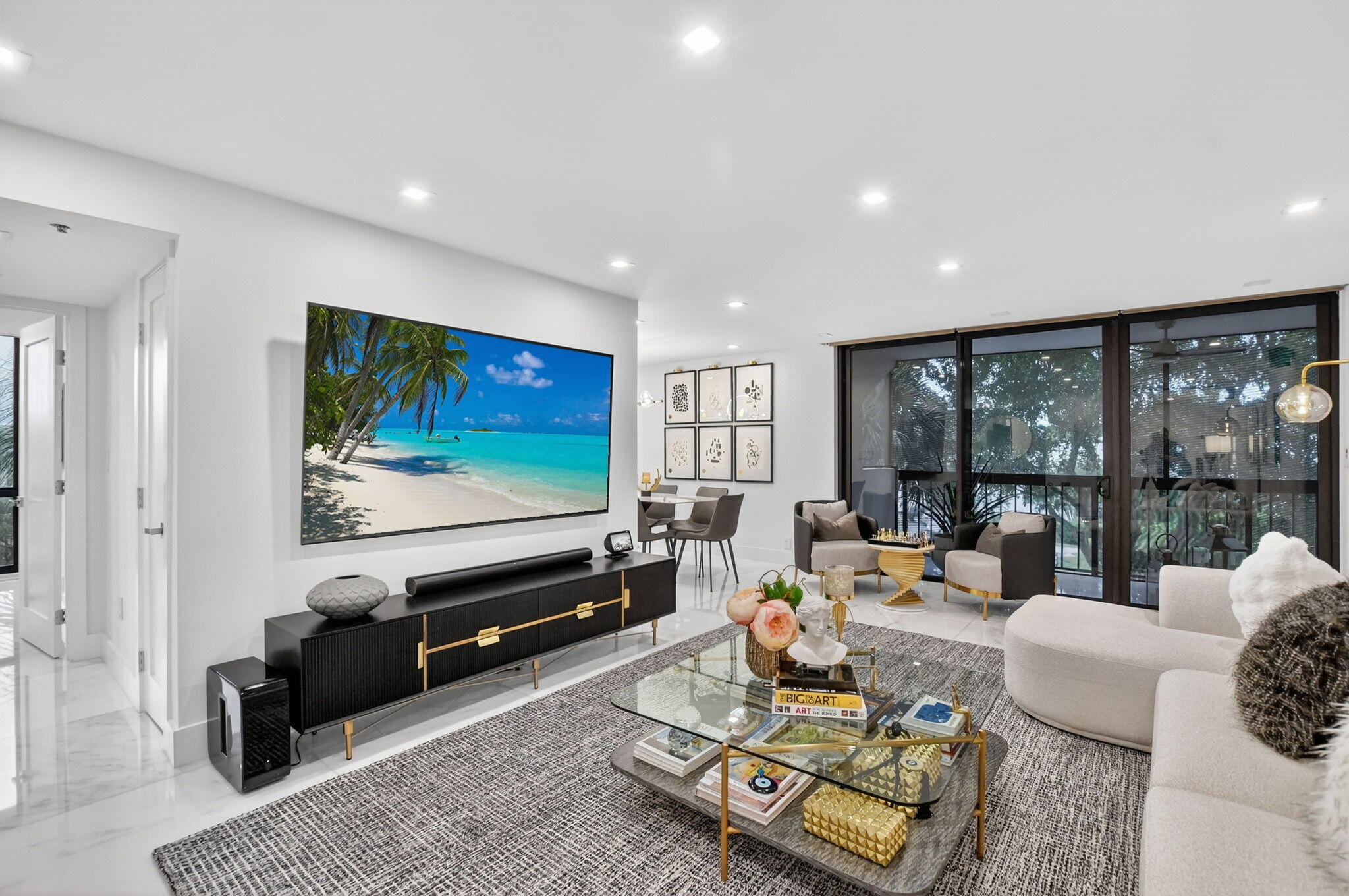 1834 Bridgewood Drive Boca Raton, FL 33434 - Photo 1 of 24 a living room with furniture flat screen tv and a large window