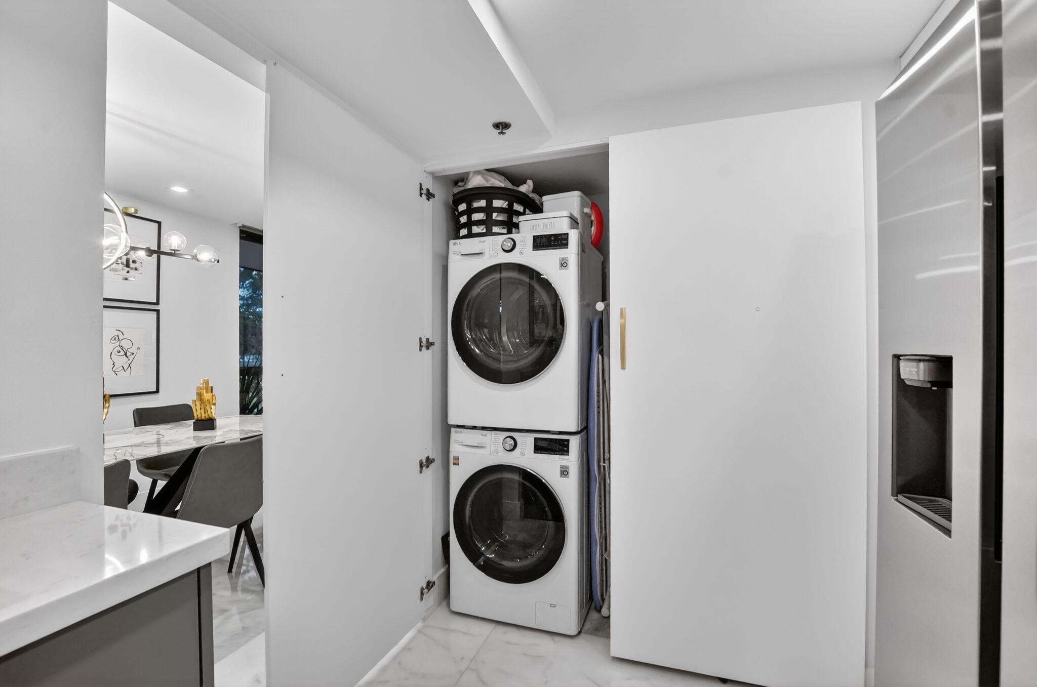 1834 Bridgewood Drive Boca Raton, FL 33434 - Photo 14 of 24 a view of a storage and utility room with washer and dryer